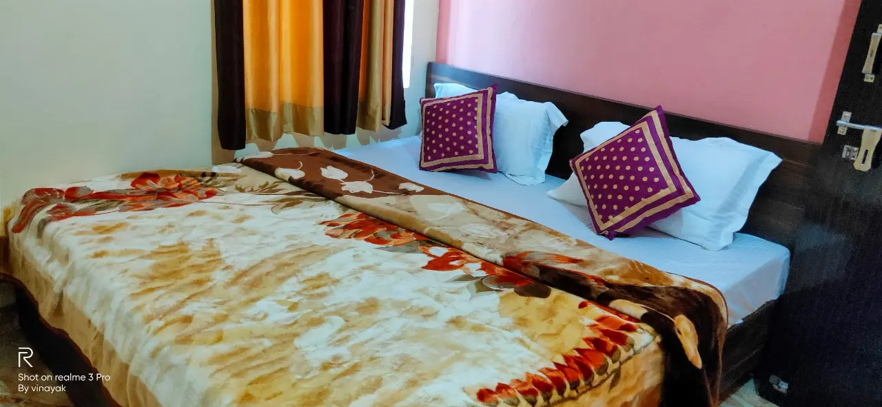 Standard non-AC room with queen bed and essential amenities